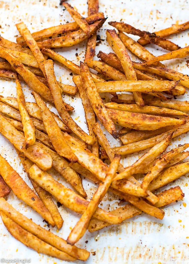 Crispy oven fries on parchment paper