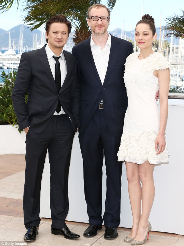 Pulling herself together: Marion managed to halt her tears to pose for snaps with Jeremy Renner and James Gray