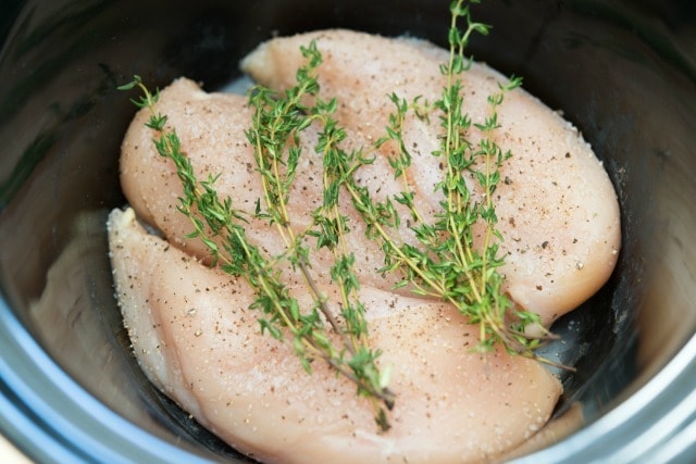 Boneless Skinless Chicken Breasts in Crockpot with Fresh Thyme on Top